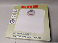 Original cardboard box of EKS mechanical scale showing scale image and basic product info.