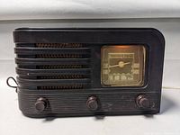 Front view of Stromberg Carlson vintage tube radio, showing tuning dial and three knobs.
