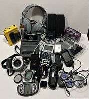 Overview of entire assortment of electronic devices with all items arranged on white background