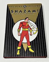 Front cover of hardcover book showing Shazam illustration and title text.