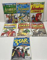 Front view of all seven DC Justice Society Returns #1 comics arranged in 3 rows, all bagged and boarded, showing clear covers and colorful classic superhero artwork.