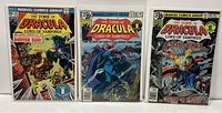 Three Marvel Tomb Of Dracula comics displayed side by side, bagged and boarded, showing front covers for issues #42, #68, and #69.