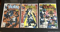 Three comic books in protective bags and boards, showing covers of Venom Funeral Pyre issues #1, #2, and #3 featuring Venom and Punisher.