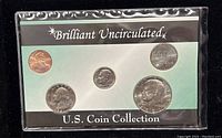 Photo of the full 5 coin set in original packaging with label 'Brilliant Uncirculated U.S. Coin Collection'.