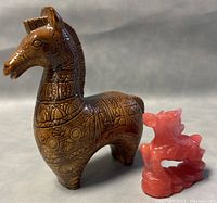 Both horse sculptures side by side showing scale and detail