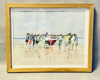 Full view of the framed watercolour painting showing the group carrying a red boat on a beach.