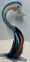 Full view of multicolor Murano Sommerso glass swan showing gradient colors and graceful neck curve.