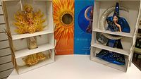 Both Goddess of the Sun Barbie and Moon Goddess Barbie in original boxes with packaging and themed background cards.
