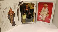 Full view of both Barbie dolls in original boxes: Uptown Chic Barbie on left, Midnight Gala Barbie on right.