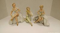 Three Wallendorf porcelain figurines displayed together