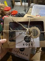 Photo of two gift boxes tied with twine showing labels for Rose scent and Perth Market brand.