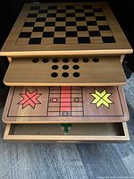 Top board with chess/checkers grid and sliding wood piece storage