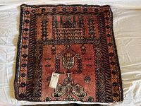 Full view of antique Persian prayer rug carpet spread out showing the pattern and condition.