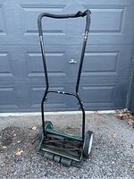 Full standing view of the Yardworks push reel lawn mower showing handle, frame, wheels and cutting mechanism from front perspective.