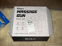 Box closed showing RJ Kiket Massage Gun Model X20 branding and specifications.
