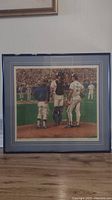 Full front view of the framed Blue Jays baseball print showing three players on the mound.