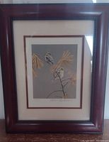 Framed Robert Bateman bird print showing full frame and matting.