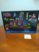 Front view of unopened LEGO Sonic the Hedgehog set 21331 box with colorful game scene build and minifigures visible.