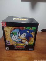 Closed original Sonic Mania Collector's Edition box with colorful graphic of Sonic holding a ring, Nintendo Switch and SEGA logos visible.