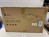 Box showing Lifepro branding, Vibration Therapy text, Hexaplate Vibration Plate Blue product name and icons for vibration therapy functions.