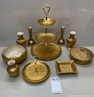 Full set of Holley Ross distinguished china arranged showing all pieces including tiered tray, vases, dishes.
