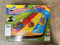 Front of box showing Jambo Triple Lane Water Splash Slide with kids on the slide and branding info