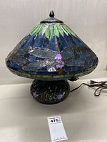 Full view of lamp showing stained glass shade and mosaic base