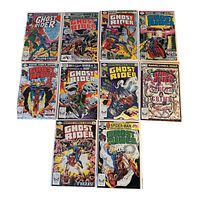 Photo showing 10 different Ghost Rider comics arranged in two rows, each protected in a clear plastic sleeve, highlighting the diverse and colorful covers from the Marvel Comics Group.