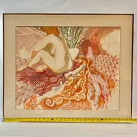 Framed watercolor painting showing nude female figure on patterned textiles with a measuring tape indicating 31 inches width of frame.