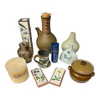 Photo showing all pottery and decorative items arranged grouped including multiple vases, mug, candle, trinket dishes, and lidded pot.