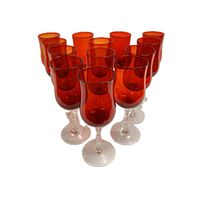 Twelve red stem glasses arranged showing front and side views, highlighting red bowl with twisted clear stems and bases