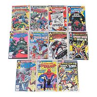 Photo showing all 11 Spiderman comics in plastic sleeves arranged in three rows. Titles include Marvel Team-Up, Amazing Spiderman, and Marvel Tales with various classic Spiderman covers.
