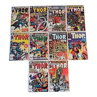 Photo showing ten Thor comics arranged in two rows with assorted Marvel characters including Spider-Man, all in plastic sleeves