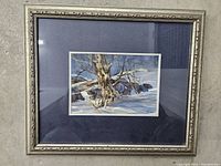 Full view of the framed watercolor landscape painting showing the tree, snow, and rocks.