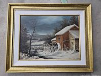 Frontal image of the painting showing the watermill and surrounding winter landscape in a gold-tone frame with white matting