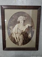 The full framed print showing the woman with the horse and the oval matting inside the frame.