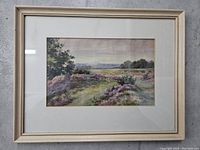 Full view of framed watercolor painting with mat under glass