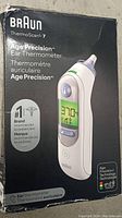 Front packaging of the Braun ThermoScan 7 ear thermometer box showing brand and product name.