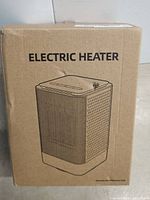 Cardboard box labeled 'Electric Heater' with sketch of heater showing perforated side vents.