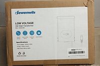 Box label showing the Lewenwils Low Voltage 300 Watt Transformer model HOSL05A, listing input voltage 120VAC and output voltage 12VAC/14VAC with max power rating 300W.