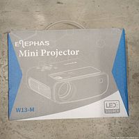Elephas branded mini projector in original box with model W13-M and LED source indicated