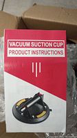 Product instructions booklet for vacuum suction cup showing usage illustration