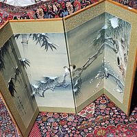 Four panel folding screen showing detailed bird, bamboo, and pine tree artwork on a fabric or paper surface with wood frame