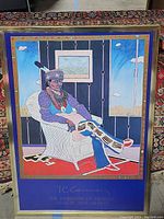 Full view of the framed decorative art print with Native American man in chair and distinctive backgrounds