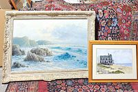 Both framed paintings displayed on patterned cloth