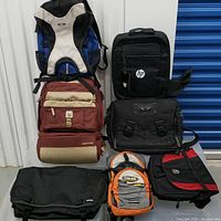 Full view of all seven bags arranged stacked and side by side showing different brands and colors
