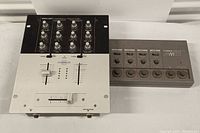 Both audio mixers shown together: white and black Stanton BMX-201 and gray Yamaha MG-52X