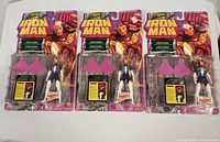 Front view of 3 packaged Marvel Iron Man Spider-Woman action figures showing figures and included accessories.
