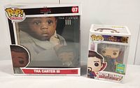 Photo showing both Funko Pop boxes: Lil Wayne Tha Carter III Pop Albums edition and Doctor Strange standard edition side by side.