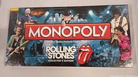 Front view of the sealed Monopoly box featuring Rolling Stones members and logos